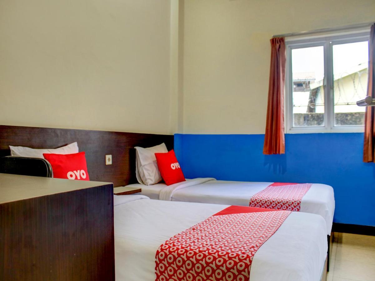 Oyo 90162 Remboelan Guest House Sungai Lutus Luaran gambar