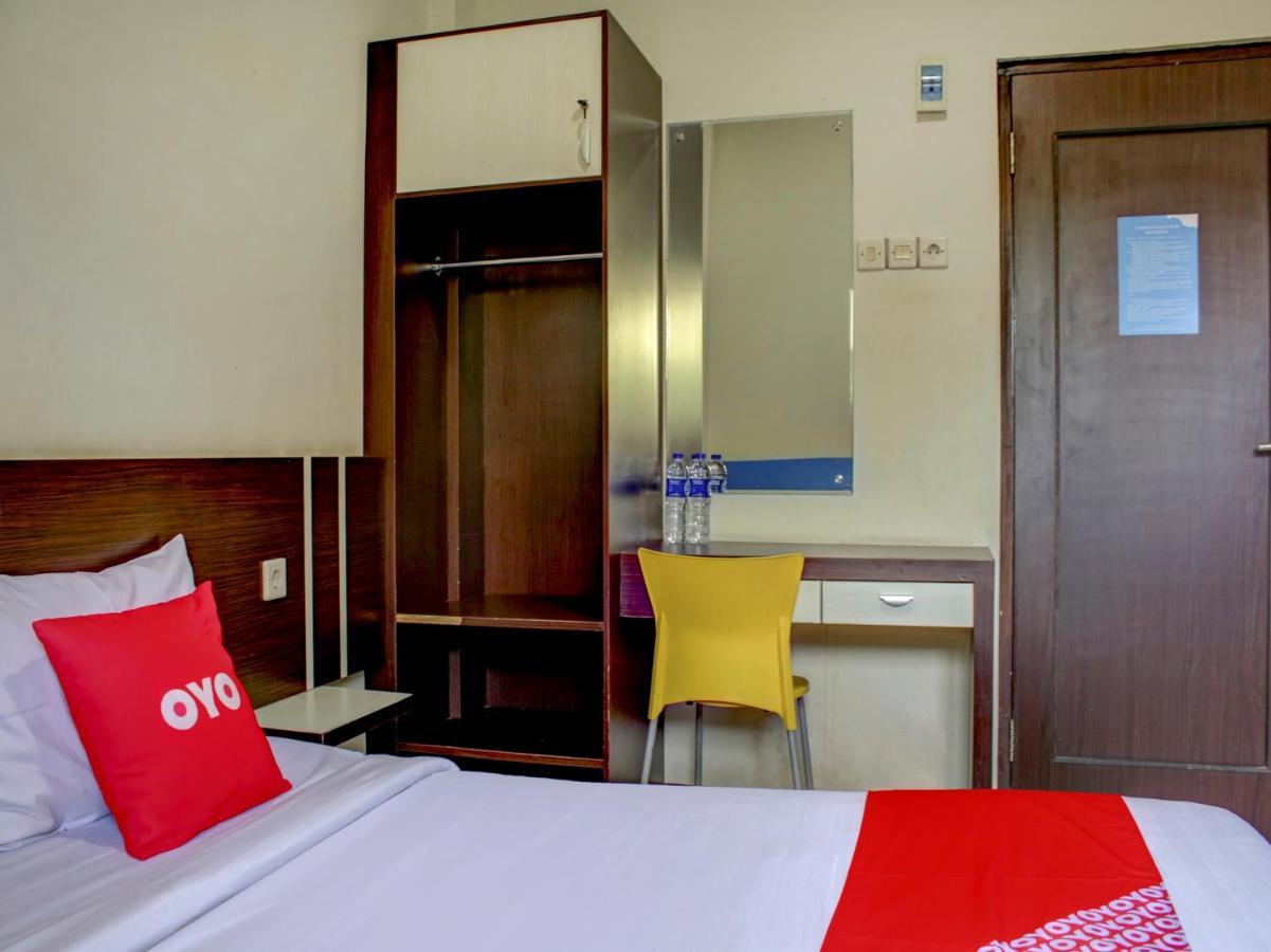 Oyo 90162 Remboelan Guest House Sungai Lutus Luaran gambar