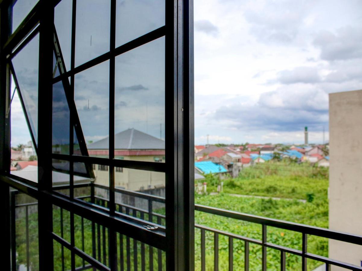 Oyo 90162 Remboelan Guest House Sungai Lutus Luaran gambar